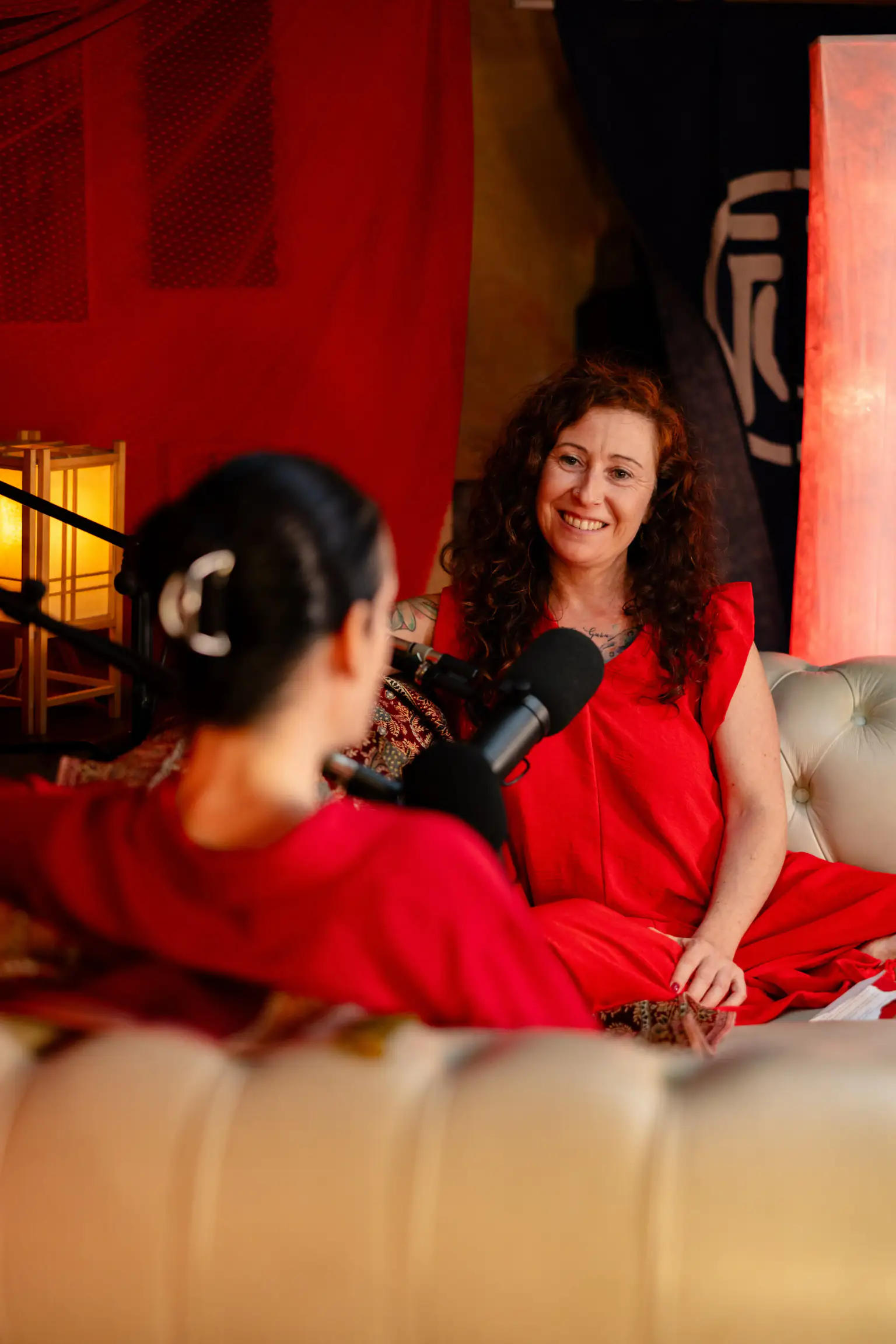 Marina podcasting in red setting